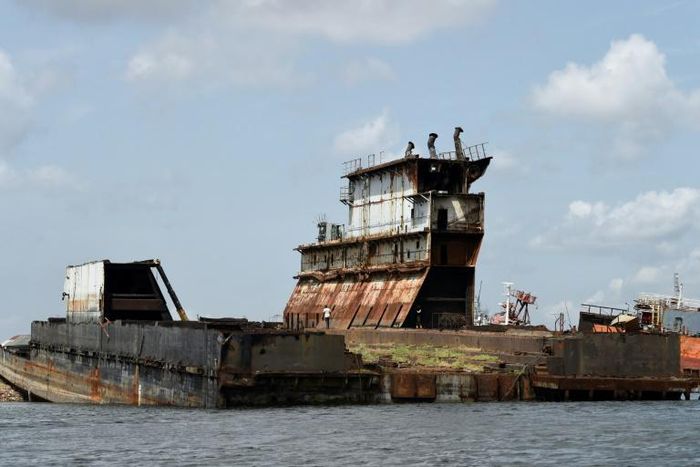 Graveyard: Dozens of shipwrecks and abandoned barges litter the Lagos waterways