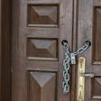 An entrance is locked with a chain at the abandoned headquarters in Riyadh of the Hariri family's collapsed construction giant Saudi Oger