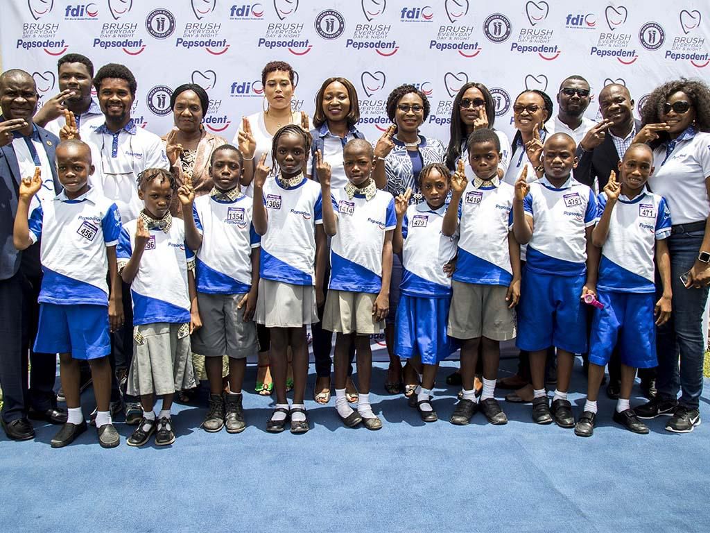 Unilever Nigeria team, representatives of the Nigerian Dental Association and school children at the event.