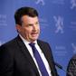 Norwegian Prime Minister Erna Solberg said she would miss justice minister Tor Mikkel Wara (L) who resigned after his partner allegedly faked attacks on the couple