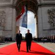 French President Emmanuel Macron, left, and Chinese President Xi Jinping laid a wreath before the eternal flame at the Arc de Triomphe in Paris on Monday