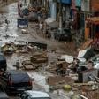 The unusually heavy rain that struck the Rio de Janeiro region triggered flash flooding that turned some streets into raging rivers, gushing through ground-level homes and businesses and weakening structures