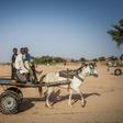 Water vendors in the arid Ouaddai district of Chad travel back and forth between meagre supplies and needy folk in town