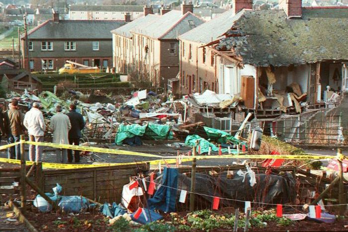 In this file photo taken on December 22, 1988, residents look at the damages caused by the explosion of the 747 Pan Am Boeing airliner that crashed over Lockerbie, Scotland, killing 270 people, including 11 on the ground.