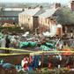 In this file photo taken on December 22, 1988, residents look at the damages caused by the explosion of the 747 Pan Am Boeing airliner that crashed over Lockerbie, Scotland, killing 270 people, including 11 on the ground.