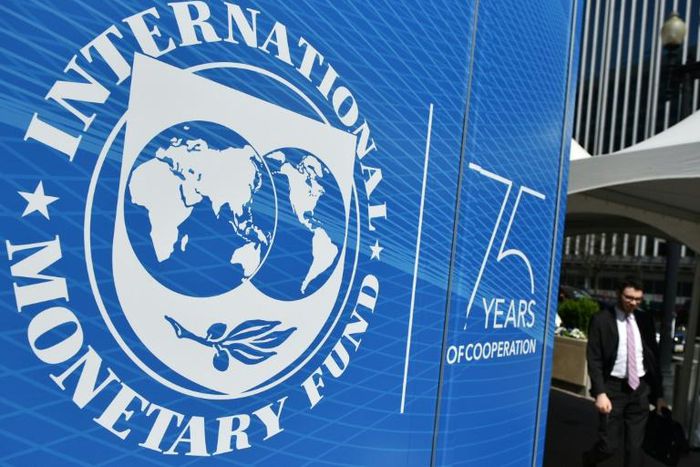 The seal of the International Monetary Fund (IMF) is seen outside of the headquarters building in Washington, DC on April 8, 2019.