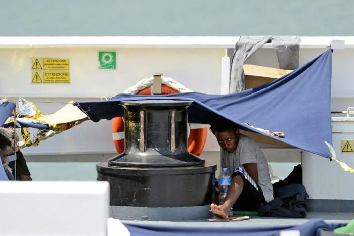 Migrants aboard the Italian coastguard ship, Diciotti, last August
