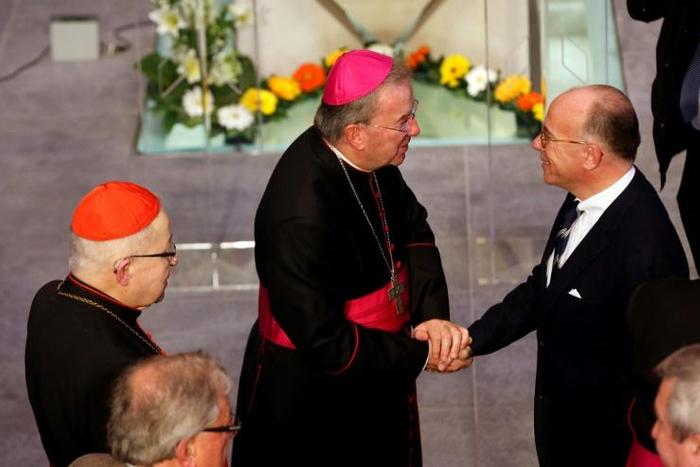 Luigi Ventura (C, pictured September 2015) is facing four complaints of sexual abuse -- including an allegation he molested a junior official at Paris town hall