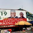 A campaign billboard bearing images of Peoples Democratic Party candidate Atiku Abubakar and his running mate Peter Obi stands on a road in Abuja on February 19, 2019, ahead of the rescheduled elections whose result Abubakar disputes