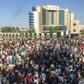 Sudanese protesters shout anti-government slogans outside the military headquarters in the capital Khartoum on April 6, 2019