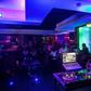 Young people enjoy the night life at the Fuschia Bar in Rwanda's capital Kigali. Many youths feel the absence of close kin they could never know, cut down in the three-month genocide