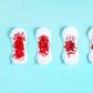 Menstrual pads with red glitter on colored background