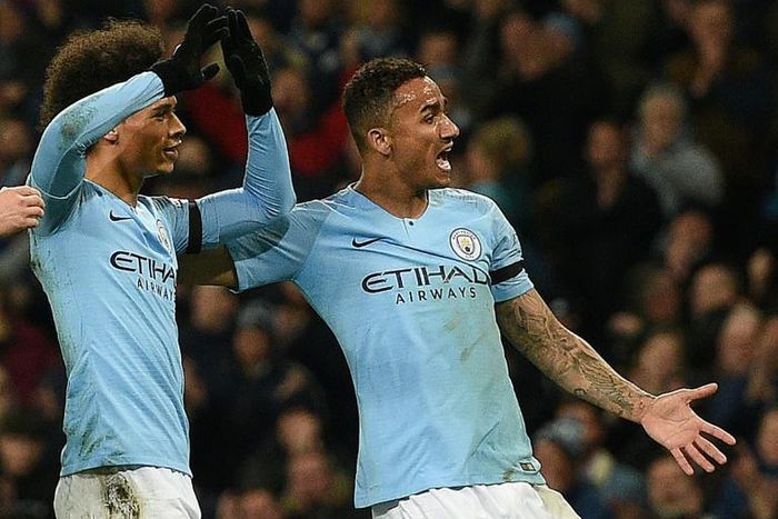 Manchester City's Leroy Sane (left) celebrates his goal against Cardiff