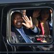 Gabonese President Ali Bongo Ondimba waves from his car upon returning to Libreville on Saturday after suffering a stroke and being treated in Morocco