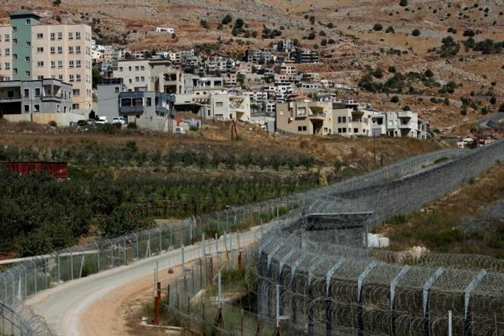 The village of Majdal Shams (L)in the Golan Heights, an area that US refers to as "Israeli-controlled" rather than "Israeli-occupied" in its latest annual human rights report