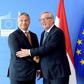 Juncker (R) has called for the Fidesz party of Orban (L) to be excluded from the EPP