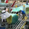 Boeing employees work on a 737 MAX jet at the company's factory in Renton, Washington -- the aviation giant has unveiled a fix to the software system of the jet, which has suffered two deadly crashes in recent months