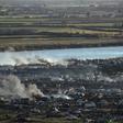 Smoke rises above the remains of the makeshift encampment on the north bank of the Euphrates River that had been the centre of the Islamic State group's last stand before it was overrun by the US-backed Syrian Democratic Forces earlier this week