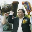 Former Hong Kong home affairs secretary Patrick Ho Chi Ping (R), pictured in a 2003 photograph with movie star Jackie Chan, was sentenced to three years in prison over a bribery scheme