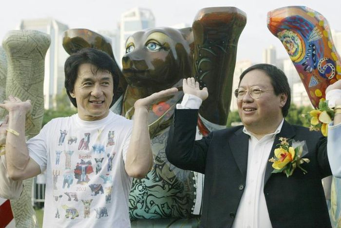 Former Hong Kong home affairs secretary Patrick Ho Chi Ping (R), pictured in a 2003 photograph with movie star Jackie Chan, was sentenced to three years in prison over a bribery scheme