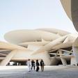 Visitors walk in front of the newly constructed National Museum of Qatar, which opens this week