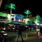Tourists on Ocean Drive, where students on Spring Break drink bucket-sized discount cocktails