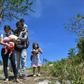 Venezuelan policeman Cesar Marcano with his wife Adriana Ballera and their children, using a mountain trail to cross into Brazil