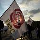People hold flags of the Common Alternative Revolutionary Force (FARC) party during a protest against a reform proposed by the government for the Special Jurisdiction for Peace (JEP) in Bogota, on March 13, 2019.