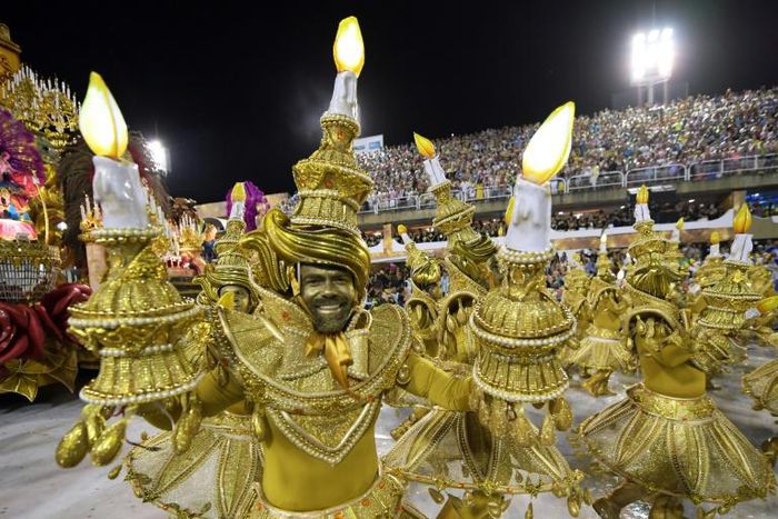 Members of the Viradouro school samba through the 700 meter Sambradrome in Rio's carnival: each school fields hundreds, if not thousands, of dancers, as well as floats and drummers