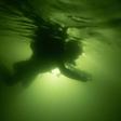 A diver explores Vietnam's Son Doong cave, the world's largest cave by volume, big enough to house a New York city block -- including 40-storey skyscrapers