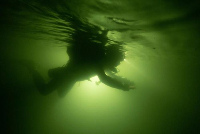 A diver explores Vietnam's Son Doong cave, the world's largest cave by volume, big enough to house a New York city block -- including 40-storey skyscrapers