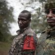 Two brigade leaders from the UPC armed group pose for photographs in the city of Bokolobo, near Bambari on March 16, 2019