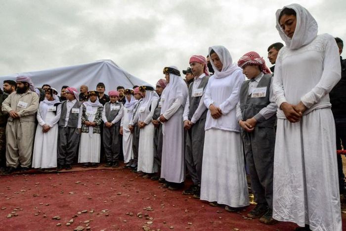 Iraqi Yazidis attended a ceremony to mark the first opening of mass grave containing victims of the Islamic State group in Sinjar region