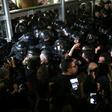 Serbian riot police clash with protesters at the state-run TV headquarters in Belgrade last Saturday