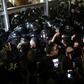 Serbian riot police clash with protesters at the state-run TV headquarters in Belgrade last Saturday
