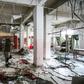 A man inspects damage and destruction at a restaurant following a reported suicide attack in the rebel-held northern Syrian city of Idlib on March 1, 2019