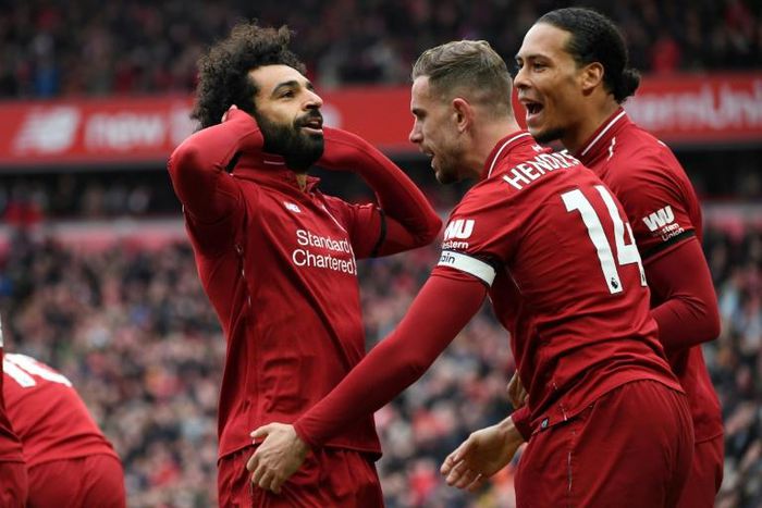 Jordan Henderson (C) created the opener in Liverpool's 2-0 win over Chelsea, with Mohamed Salah (L) smashing home the second