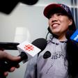 Vanessa Rodel smiles during a media scrum after arriving with her daughter Keana to the Toronto airport on a flight from Hong Kong, in Toronto, Canada, March 25, 2019