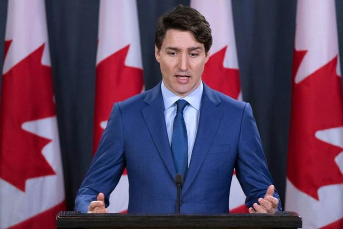Canadian Prime Minister Justin Trudeau -- seen here addressing the media -- has seen his image take a hit over a bribery scandal that led two of his ministers to resign