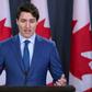 Canadian Prime Minister Justin Trudeau -- seen here addressing the media -- has seen his image take a hit over a bribery scandal that led two of his ministers to resign