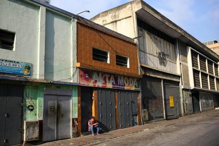 Shuttered stores and deserted streets in blackout-hit Caracas on March 27, 2019