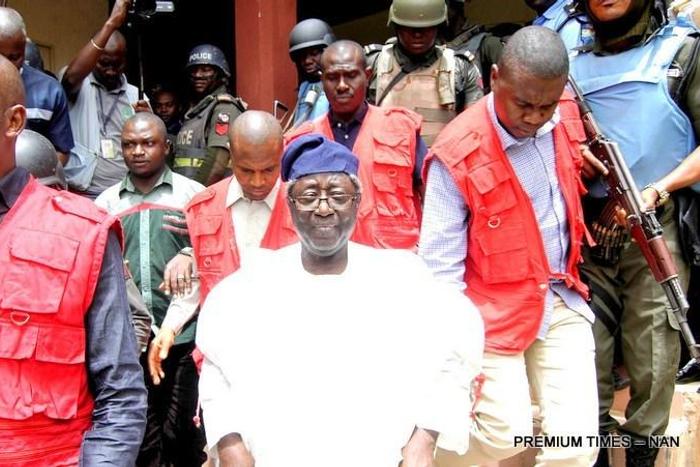 Former governor of Plateau state Jonah Jang being led out of court by the operatives of the Economic and Financial Crimes Commission (EFCC) [premiumtimesng]