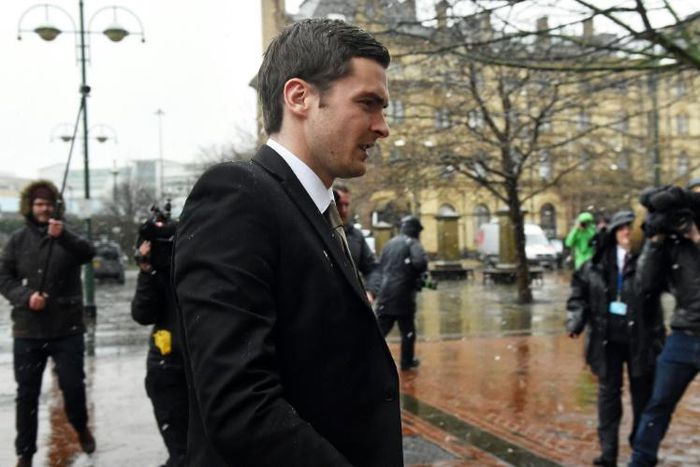 Former Sunderland footballer Adam Johnson (C) arrives at Bradford Crown Court in Bradford, northern England, on March 2, 2016