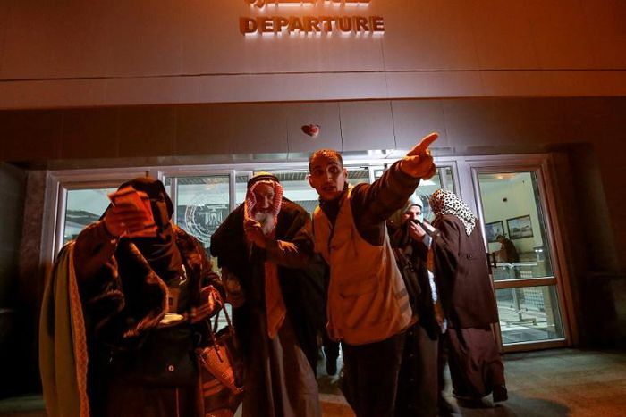 Palestinians get ready to board a bus at the Rafah border between the Gaza Strip and Egypt on March 3, 2019 as they make their way to Saudi Arabia for the Muslim umra pilgrimage