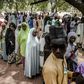 Wait: Voters queue at a polling station in Malkohi refugee camp in Adamawa state -- a facility for people displaced by the Boko Haram jihadist insurgency