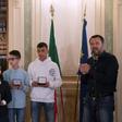 Italian Deputy Premier and Interior Minister Matteo Salvini (R) meets with five children who helped to save other children during the March 20, 2019 Milan bus attack, saying they deserve Italian nationality
