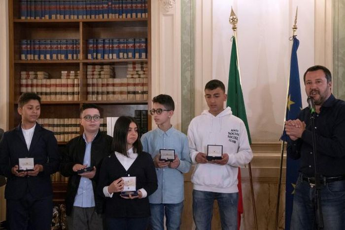 Italian Deputy Premier and Interior Minister Matteo Salvini (R) meets with five children who helped to save other children during the March 20, 2019 Milan bus attack, saying they deserve Italian nationality