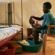 A mother washes her newborn infant at a hospital in a protected civilian site in Malakal, South Sudan. To encourage the peace process the Vatican is hosting a retreat for the warring rival leaders