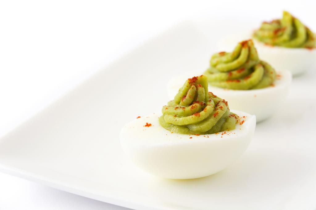 Stuffed eggs with guacamole and paprika