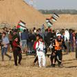 Palestinian paramedics carry a wounded protester during a demonstration near the border between Israel and the Gaza Strip on April 12, 2019